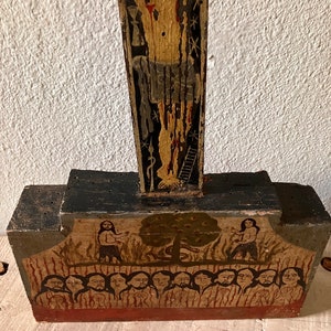 May include: A white ceramic mug with a black handle and the text "But First, Coffee" in a bold, black font. The mug is set against a blurred background, highlighting its clean design.