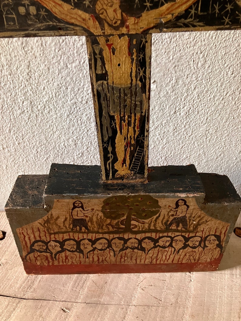 May include: A white ceramic mug with a black handle and the text "But First, Coffee" in a bold, black font. The mug is set against a blurred background, highlighting its clean design.