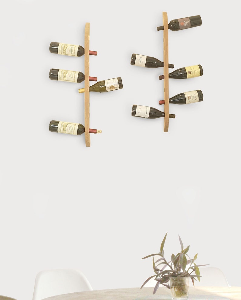 This Viking Longship (langskib) inspired wine rack brings the essence of a journey into your home or office. Each bottle angled downward, wine stays in contact with the cork. 8 ports wine bottles which allow opposing storage of four bottles per side.
