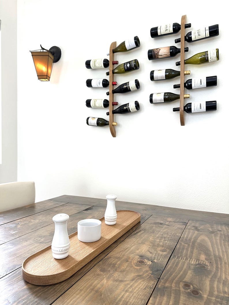 This Viking Longship (langskib) inspired wine rack brings the essence of a journey into your home or office. Each bottle angled downward, wine stays in contact with the cork. 8 ports wine bottles which allow opposing storage of four bottles per side.