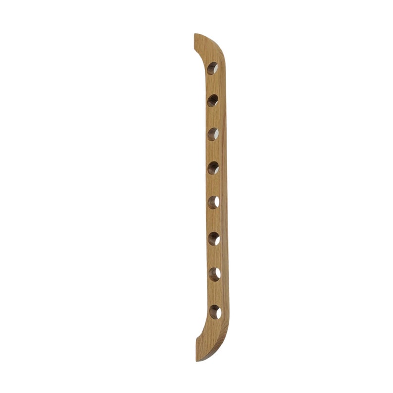 This Viking Longship (langskib) inspired wine rack brings the essence of a journey into your home or office. Each bottle angled downward, wine stays in contact with the cork. 8 ports wine bottles which allow opposing storage of four bottles per side.