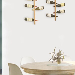 This Viking Longship (langskib) inspired wine rack brings the essence of a journey into your home or office. Each bottle angled downward, wine stays in contact with the cork. 8 ports wine bottles which allow opposing storage of four bottles per side.