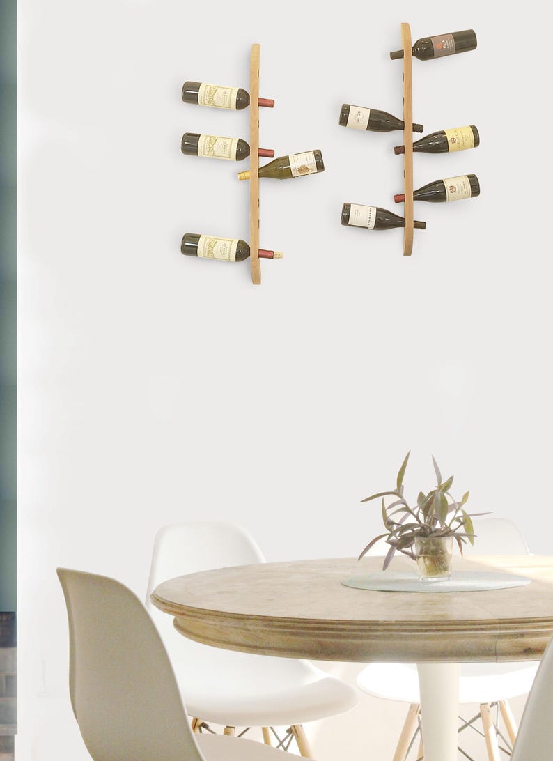 This Viking Longship (langskib) inspired wine rack brings the essence of a journey into your home or office. Each bottle angled downward, wine stays in contact with the cork. 8 ports wine bottles which allow opposing storage of four bottles per side.