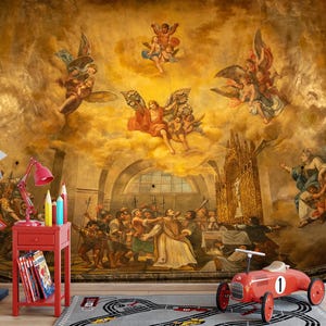 May include: A red toy race car with the number 1 on the side sits on a gray rug with a race track design. The background is a large mural with figures and angels in a golden-toned setting. A red side table with books and a lamp is on the left.