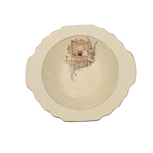 May include: Cream-colored serving dish with a scalloped edge and gold trim. The center features a painted scene of a window box with flowers. The dish is round with a shallow depth, suitable for serving.