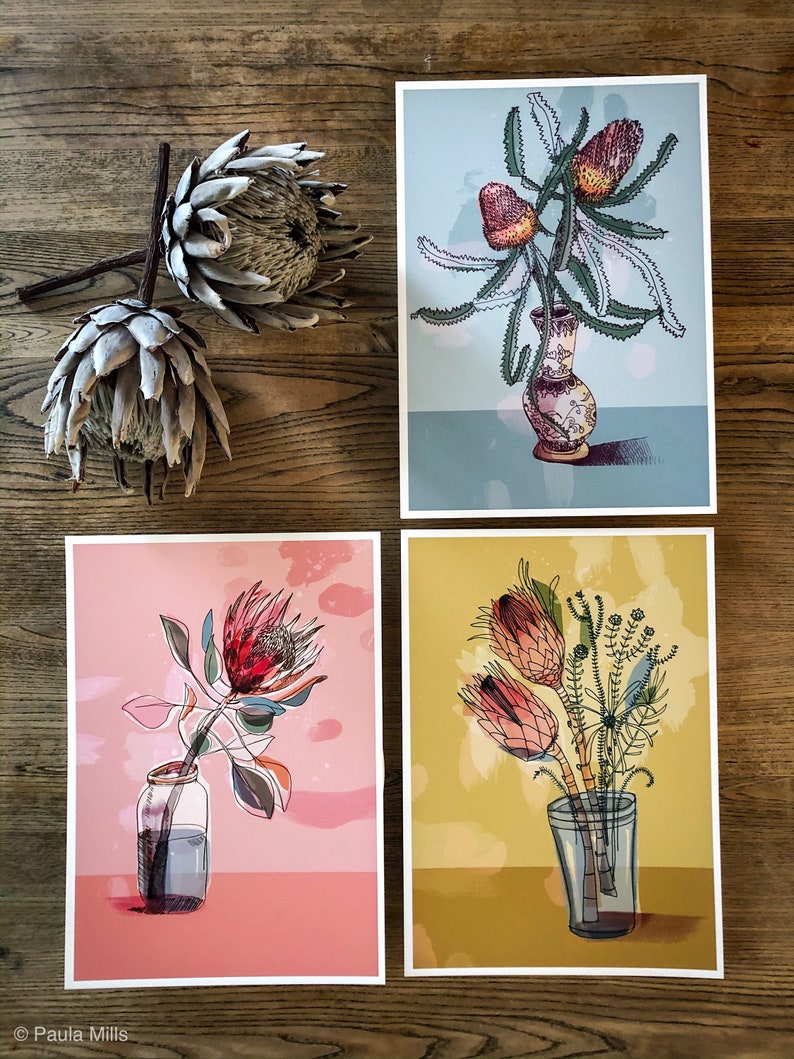 May include: Four different floral prints featuring various types of flowers in vases. The prints are on a light pink, light blue, yellow, and white background.