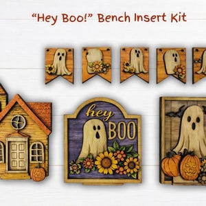 May include: Wooden Halloween-themed bench insert kit with a house, banners, and signs. The inserts feature ghosts, pumpkins, and sunflowers. The text "Hey Boo!" is visible on one of the signs.