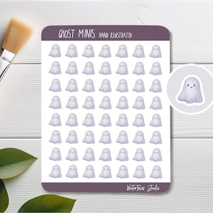 May include: Sheet of stickers featuring small, light purple ghost illustrations with smiling faces. The text "GHOST MINIS HAND ILLUSTRATED" is at the top. A single ghost sticker is shown in a circle. The bottom right corner has the text "Watertales Studio".
