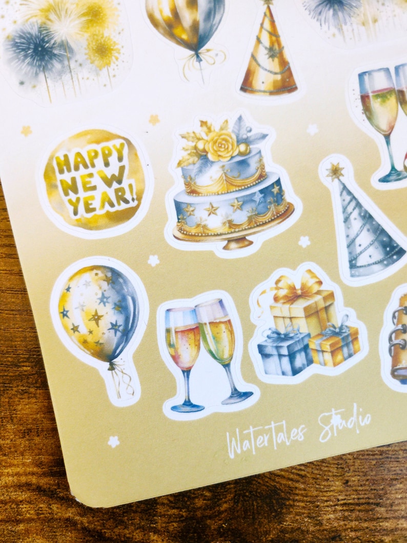 May include: Sheet of New Year's Eve stickers featuring watercolor illustrations. Designs include fireworks, balloons, party hats, champagne glasses, a two-tiered cake, and gift boxes. The text "HAPPY NEW YEAR!" is also included.