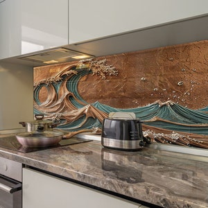 Op de afbeelding: Een moderne keuken met een bruin en blauwe golfvormige achterwand. De achterwand is gemaakt van keramische tegels en heeft een 3D-effect. Een zwarte broodrooster staat op het aanrecht voor de achterwand.