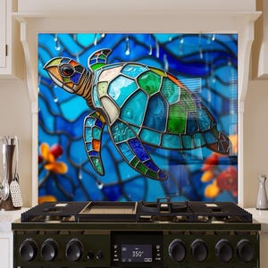 May include: A stained glass style sea turtle with blue, green, and orange accents against a blue background with raindrops. The turtle is swimming in the ocean.