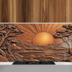 May include: A copper-colored metal backsplash with a 3D embossed design of a sunrise over a mountain range and a lake. The design includes two trees on either side of the scene.