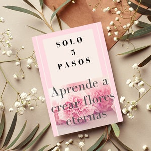 May include: Pink card with the text "SOLO 5 PASOS" and "Aprende a crear flores eternas". The card is surrounded by white flowers.