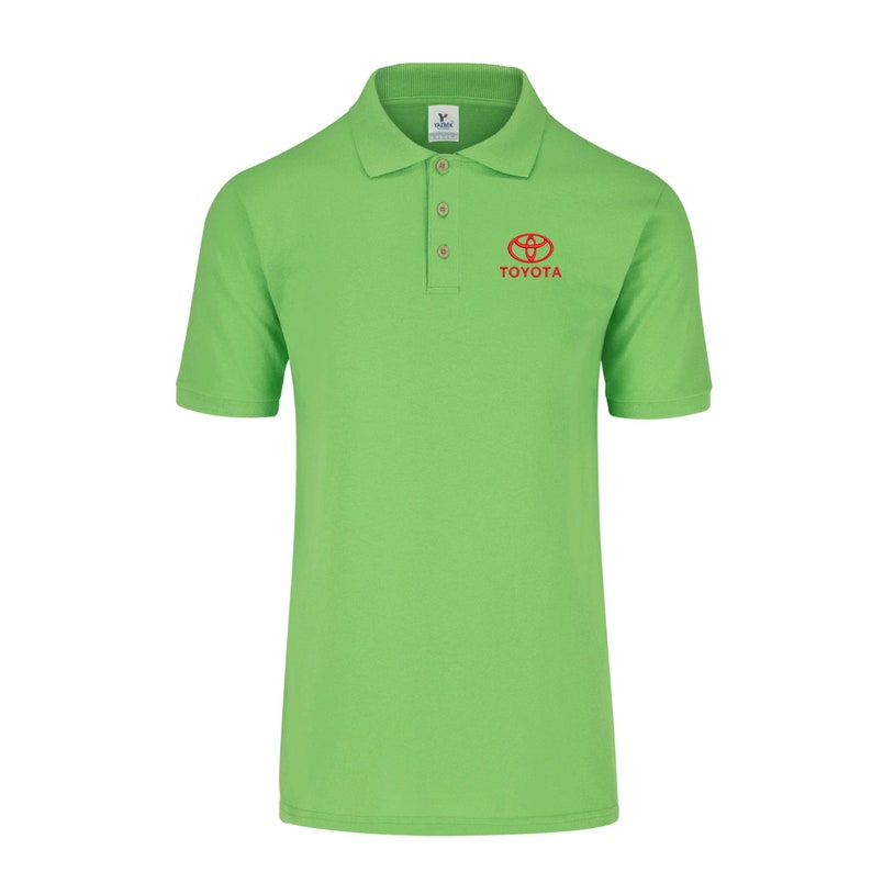 May include: A green polo shirt with a red Toyota logo and the word "TOYOTA" embroidered on the chest.