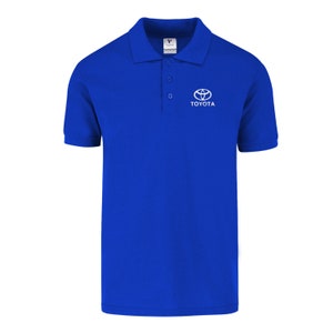 May include: A royal blue polo shirt with a white Toyota logo and the word "TOYOTA" printed below it.