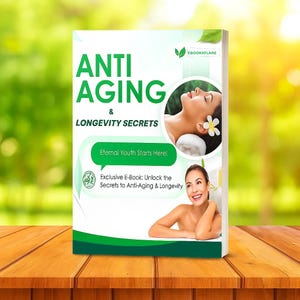 May include: A book titled "Anti Aging & Longevity Secrets" with the text "Eternal Youth Starts Here!". The cover features images of women and a flower. The book is on a wooden table with a blurred green background.