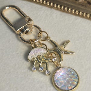 Ocean themed charm keychain,  beachy vibe keyring gift,  jellyfish starfish key fob,  purse accessory mermaid scale backpack charm
