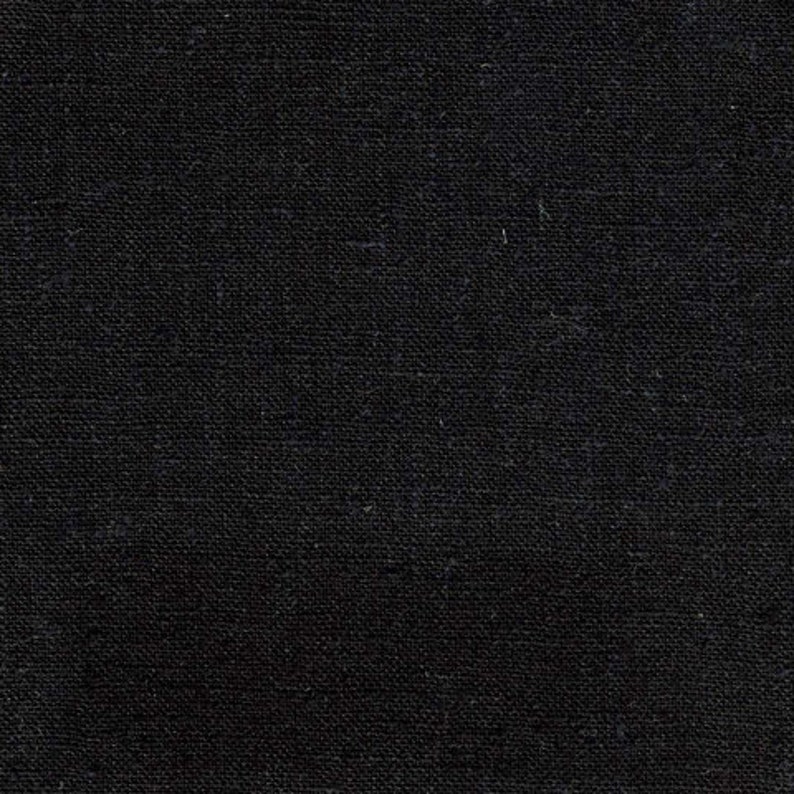 Puede incluir: Primer plano de una textura de tela negra con un patr&oacute;n tejido.