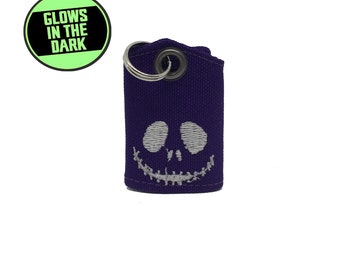 Protector de bolsa y silenciador con etiqueta que brilla en la oscuridad inspirado en Jack Skellington