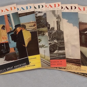 May include: A collection of eight vintage Railroad Magazine issues from February to December 1950. The covers feature colorful illustrations of trains and locomotives.
