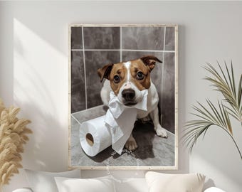 Puede incluir: Un perro marrón y blanco con un rollo de papel higiénico blanco en la boca, mirando directamente a la cámara. El perro está en un baño con paredes de azulejos grises.