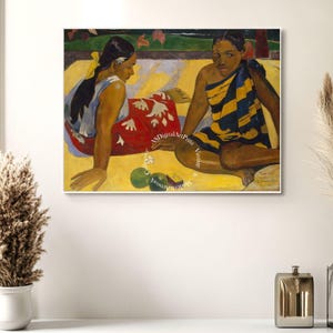 May include: A painting of two women sitting on a yellow sand beach. The woman on the left is wearing a red and white dress and the woman on the right is wearing a yellow and black striped dress. There are green fruits in front of them.