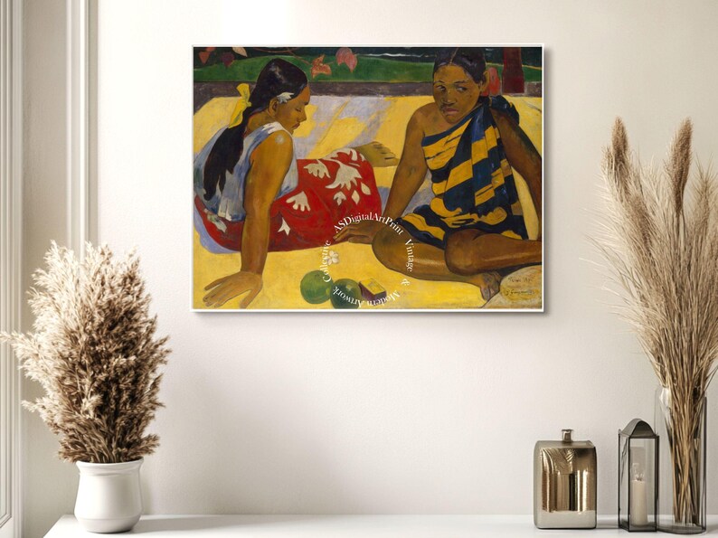 May include: A painting of two women sitting on a yellow sand beach. The woman on the left is wearing a red and white dress and the woman on the right is wearing a yellow and black striped dress. There are green fruits in front of them.