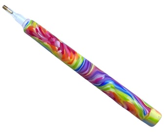 May include: A colourful diamond painting pen with a rainbow swirl design. The pen has a clear tip and a gold metal tip.
