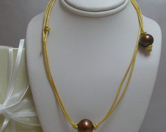 Chocolate Pearls on Golden metallic Leather with toggle clasp