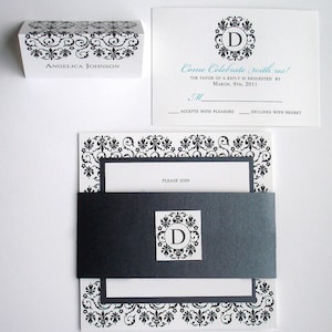 May include: Black and white wedding invitation with a decorative border. The invitation features a monogram with the letter "D" in a circle. The text reads "Come Celebrate with us! The favor of a reply is requested by March, 9th, 2011. M. Accepts with pleasure. Declines with regret. Please join."