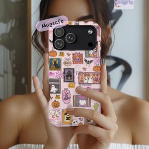 May include: A light pink smartphone case featuring a repeating pattern of Halloween-themed illustrations including pumpkins, ghosts, a black cat, a haunted house, bats, spiderwebs, and a witch hat, with the text Magsafe and Cozyria visible.