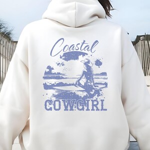 Coastal Cowgirl Vintage Beach Hoodie |Surfboard & Cowboy Hat |Summer Aesthetic Retro Beach Hoodie |Bikini Girl Surfboard Graphic |Santorini