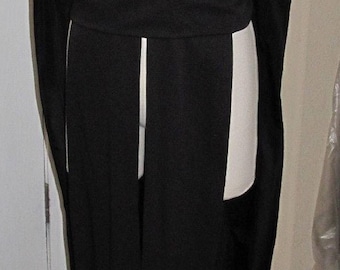 May include: A black sleeveless robe with a V-neckline and a long, flowing skirt. The robe has a belt at the waist and a cape-like collar.