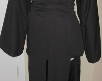 May include: A black hooded robe with a long, flowing skirt and a sash tied at the waist.