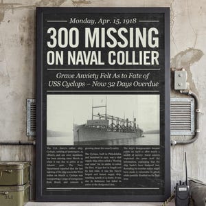 May include: Black framed vintage newspaper print with the headline "300 MISSING ON NAVAL COLLIER." The image features a black and white photo of a ship and text detailing the USS Cyclops' disappearance in 1918.