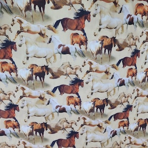May include: Fabric with a repeating pattern of running horses in various colors, including brown, white, and tan. The horses have flowing manes and tails, creating a dynamic and lively design. The background is a light beige.