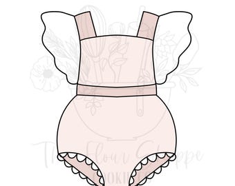 May include: A light pink onesie cookie cutter with a scalloped edge. The onesie has straps and ruffled sleeves. The Flour Shoppe Cookie logo is visible in the background.