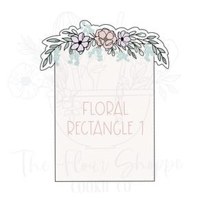 May include: A cookie cutter in the shape of a rectangle, adorned with a floral design. The flowers are in shades of pink and purple, with green leaves. The text "FLORAL RECTANGLE 1" is visible.
