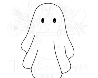 May include: A black and white line drawing of a ghost with two black oval eyes. The ghost is wearing a sheet with rounded edges. The background includes a floral design and the text "The Flour Shoppe Cookie Co."
