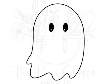 May include: A black and white ghost-shaped cookie cutter with two black eyes. The ghost has a curved bottom and a simple, cartoonish design. The text "The Flour Shoppe COOKIE CO" is at the bottom. Ideal for Halloween baking.