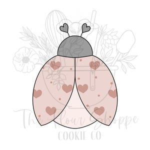 May include: A ladybug-shaped cookie cutter with a light pink body and brown heart accents. The ladybug has a gray head and heart-shaped antennae. The Flour Cookie Co. logo is at the bottom.