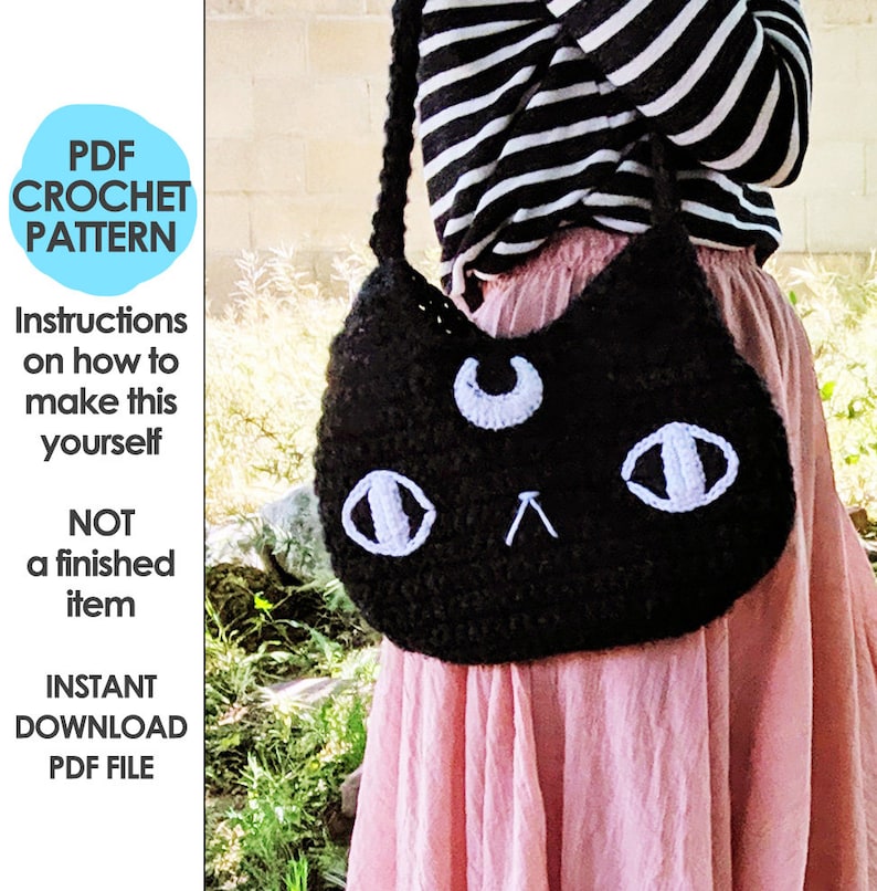 May include: A crochet pattern for a black cat-shaped shoulder bag with white eyes and a crescent moon on the front. The pattern is available for instant download as a PDF file.