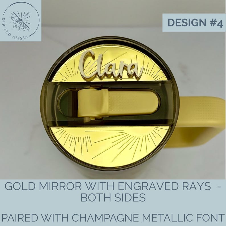 May include: A yellow tumbler lid featuring a gold mirror acrylic topper with engraved sunburst rays. The name Clara is displayed in a raised champagne metallic script font. The lid includes a dark translucent sliding closure mechanism.