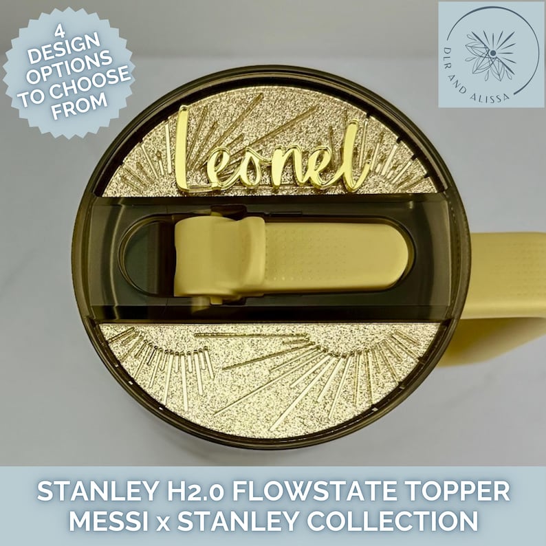 May include: A circular gold glitter tumbler lid topper featuring a sunburst pattern and the name Leonel in gold script lettering. The topper is designed for a Stanley H2.0 FlowState tumbler and includes a central cutout for the straw and handle.