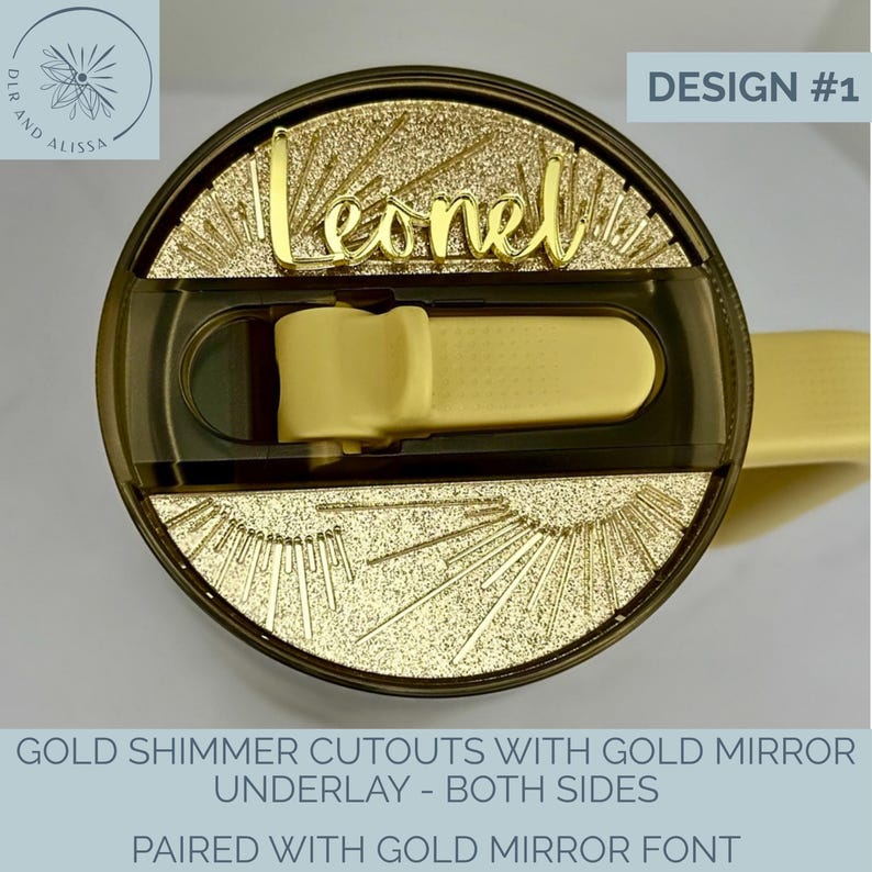 May include: A circular tumbler lid featuring a gold glitter sunburst design and a central gold mirror script nameplate reading Leonel. The lid includes a dark translucent plastic sliding closure mechanism and a light yellow sip cover.