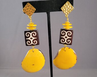 Adinkra Adorned clip on earrings with yellow Tagua nut and brown batik bone