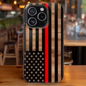 May include: A phone case featuring a design inspired by the American flag. The case has a wooden texture with black and brown vertical stripes, a red stripe, and a section with stars.
