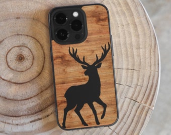 May include: A brown wooden phone case with a black silhouette of a deer. The case has a black camera bump with three lenses.