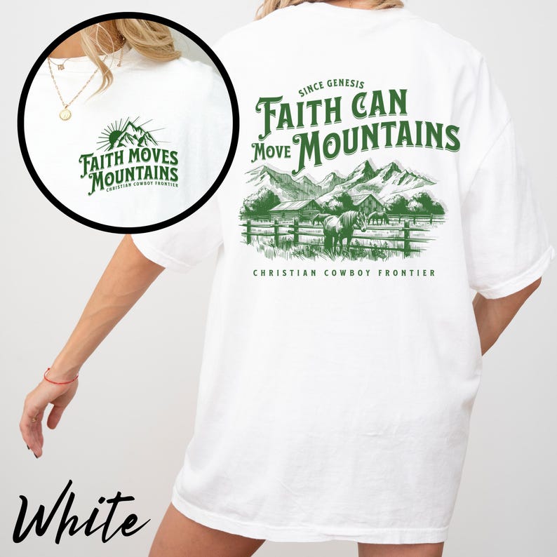 May include: White t-shirt with green text and graphics. The front features a small mountain graphic with the words "Faith Moves Mountains." The back displays a larger design with mountains, a fence, and horses, along with the text "Faith Can Move Mountains."