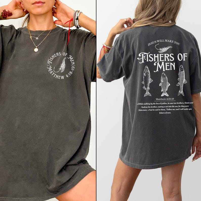 May include: Dark grey t-shirt with the text "FISHERS OF MEN" and a graphic of a fish hook on the front. The back of the shirt features the text "JESUS WILL MAKE YOU FISHERS OF MEN" with fish illustrations and a Bible verse.